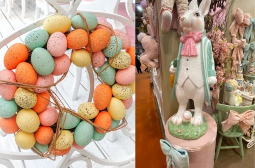 Guirlanda de ovos de Páscoa coloridos e estátua de coelho decorativo.